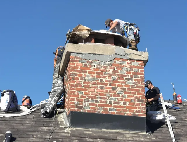 Stonington Chimney Sweep installing a custom chimney crown in Stonington, CT