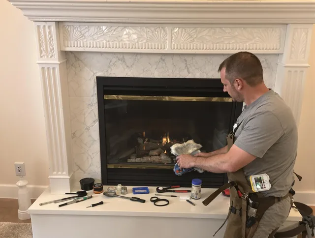 Stonington Chimney Sweep performing fireplace maintenance in Stonington, CT