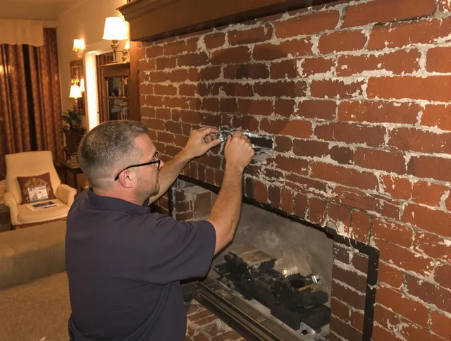 Stonington Chimney Sweep expert fixing a fireplace in Stonington, CT